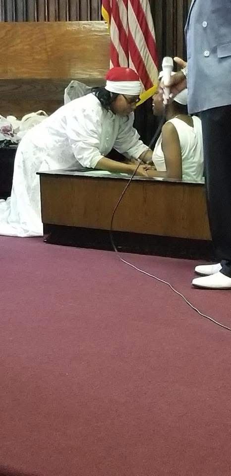 Prophetess Cheryl Praying Over a Young Believer