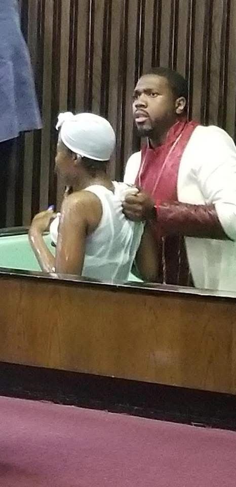 Bishop Singletary Preparing a New Believer for Baptism